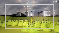 a group of people in yellow dresses posing for a photo